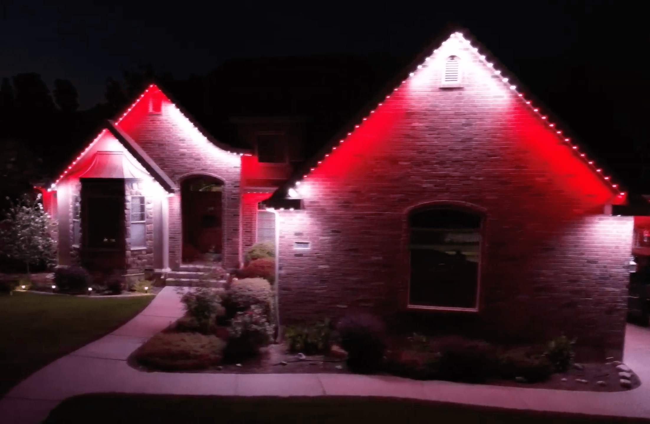 Music sync lighting display on a home during the holidays (TruLight network install)